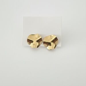 Gold tone earrings wave texture